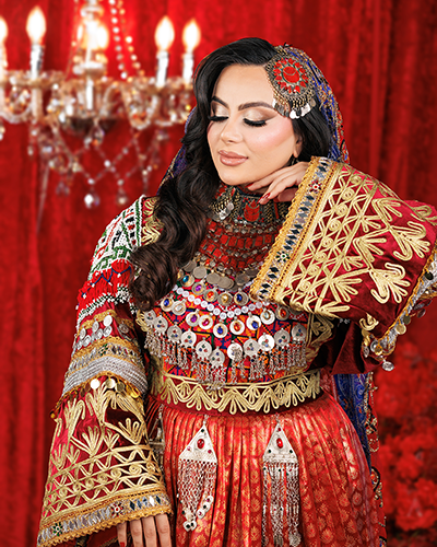 Family and friends celebrating at a colorful henna night event